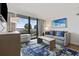 Relaxing living room featuring ocean views, comfortable seating, and a flat-screen TV at 3000 N Ocean Blvd. # 130, Myrtle Beach, SC 29577