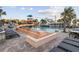 Gathering-friendly pool with slide, lounge chairs, and poolside bar for relaxation at 3000 N Ocean Blvd. # 130, Myrtle Beach, SC 29577