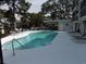 Inviting community pool with lounge chairs, umbrellas, and covered grilling area at 305 N Hillside Dr. N # 103, North Myrtle Beach, SC 29582