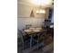 Dining area adjacent to kitchen with seating for four at 305 N Hillside Dr. N # 103, North Myrtle Beach, SC 29582