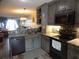 Open kitchen featuring stainless appliances and stone countertops at 305 N Hillside Dr. N # 103, North Myrtle Beach, SC 29582