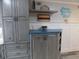 Kitchenette with custom cabinets and ample storage at 305 N Hillside Dr. N # 103, North Myrtle Beach, SC 29582