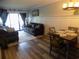 Inviting living room features a comfortable seating arrangement and access to a private outdoor space at 305 N Hillside Dr. N # 103, North Myrtle Beach, SC 29582