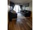 Living room offering balcony access with plenty of natural light at 305 N Hillside Dr. N # 103, North Myrtle Beach, SC 29582
