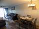 Cozy living and dining area combination with access to balcony at 305 N Hillside Dr. N # 103, North Myrtle Beach, SC 29582