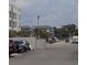 Street view showcasing parking and surrounding buildings at 305 N Hillside Dr. N # 103, North Myrtle Beach, SC 29582