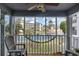 Relaxing screened porch with views of the pond and building at 305 N Hillside Dr. N # 103, North Myrtle Beach, SC 29582
