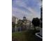 Scenic view from screened window with trees and building at 305 N Hillside Dr. N # 103, North Myrtle Beach, SC 29582