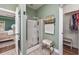 En-suite bathroom with a glass-enclosed shower and convenient access to the walk-in closet at 318 Board Landing Circle, Conway, SC 29526