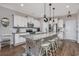 Modern kitchen with white cabinets, granite countertops, stainless steel appliances, and a large center island at 318 Board Landing Circle, Conway, SC 29526