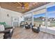 Relaxing screened porch with views and comfortable wicker seating at 318 Board Landing Circle, Conway, SC 29526