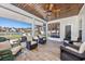Inviting screened porch with ample seating and a view of the lake at 318 Board Landing Circle, Conway, SC 29526