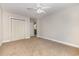 Bedroom with carpet, ceiling fan, closet, and access to the laundry room and bathroom at 3704 Chapel Ln., Myrtle Beach, SC 29588