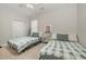 Bright bedroom with twin beds, ceiling fan, neutral tones, and carpeted floor for a cozy atmosphere at 3704 Chapel Ln., Myrtle Beach, SC 29588