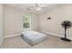 Bright bedroom featuring carpet floors, a window overlooking nature, a ceiling fan, and a small bed at 3704 Chapel Ln., Myrtle Beach, SC 29588