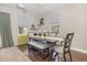 Well-lit dining room with stylish table setting and seating, complemented by a modern chandelier at 3704 Chapel Ln., Myrtle Beach, SC 29588