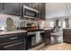 Modern kitchen design with stainless steel oven and appliances, plus dark cabinets at 3704 Chapel Ln., Myrtle Beach, SC 29588