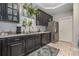 Well-equipped kitchen with stainless steel appliances, ample counter space, and tiled floors at 3704 Chapel Ln., Myrtle Beach, SC 29588