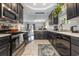 Chef's kitchen with stainless steel appliances, pendant lights, and an open layout at 3704 Chapel Ln., Myrtle Beach, SC 29588