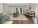 Spacious living area with hardwood floors, a dining table, comfortable seating, and lots of natural light at 3704 Chapel Ln., Myrtle Beach, SC 29588