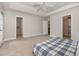 Spacious main bedroom with a tray ceiling, carpeted flooring, and ensuite bathroom and closet at 3704 Chapel Ln., Myrtle Beach, SC 29588