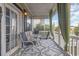 Relaxing porch seating with outdoor table and chairs and neutral outdoor carpet at 3704 Chapel Ln., Myrtle Beach, SC 29588