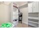 Organized walk-in closet featuring built-in shelving and drawers for ample storage space at 3704 Chapel Ln., Myrtle Beach, SC 29588