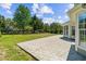 Spacious backyard featuring a cement patio and lush green grass at 4025 Captiva Row, Myrtle Beach, SC 29579