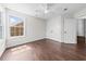 Bedroom featuring a ceiling fan, hardwood floors, closet, and window at 4025 Captiva Row, Myrtle Beach, SC 29579