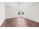 Bedroom featuring a ceiling fan, hardwood floors, and double windows at 4025 Captiva Row, Myrtle Beach, SC 29579