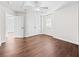 Bedroom featuring a ceiling fan, hardwood floors, closet, and white trim at 4025 Captiva Row, Myrtle Beach, SC 29579