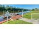 Dock with a boardwalk entrance, pier, and boat lift at 4025 Captiva Row, Myrtle Beach, SC 29579