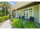 Charming front porch with elegant columns, seating, and lush landscaping at 4025 Captiva Row, Myrtle Beach, SC 29579