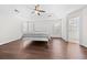Main bedroom with hard wood floors, tray ceilings, and two windows allowing lots of natural light at 4025 Captiva Row, Myrtle Beach, SC 29579