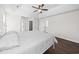 Main bedroom with a tray ceiling, fan, and wood floors at 4025 Captiva Row, Myrtle Beach, SC 29579