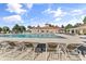 Beautiful pool area with a large swimming pool, plenty of lounge chairs, and a clubhouse at 4025 Captiva Row, Myrtle Beach, SC 29579