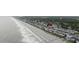 An aerial view displays close beach access of the home, ideal for enjoying the coastal lifestyle and ocean views at 412 Seaside Dr. S, Surfside Beach, SC 29575