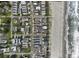 An aerial view showcases the desirable neighborhood near a beach and offers a pool at 412 Seaside Dr. S, Surfside Beach, SC 29575