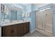 Bright bathroom with double sinks, lots of counter space, and glass shower at 412 Seaside Dr. S, Surfside Beach, SC 29575