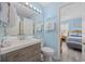 Well-lit bathroom with a spacious vanity, modern fixtures, and coastal-themed decor at 412 Seaside Dr. S, Surfside Beach, SC 29575