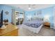 Comfortable bedroom with balcony access, beachy decor, and appealing furnishings at 412 Seaside Dr. S, Surfside Beach, SC 29575
