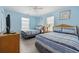 Bright bedroom featuring two beds, blue walls, and light-colored floors for a coastal feel at 412 Seaside Dr. S, Surfside Beach, SC 29575
