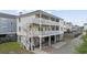 Desirable home with multi-level balconies, beautiful paint, and lovely landscaping at 412 Seaside Dr. S, Surfside Beach, SC 29575