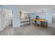 Open living space with a dining area, kitchen, and laundry access at 412 Seaside Dr. S, Surfside Beach, SC 29575