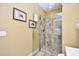 Bathroom showcases a glass enclosed tiled shower with tan-colored tile and decorative wall art at 4850 Cantor Ct. # 202, North Myrtle Beach, SC 29582