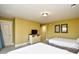 Bright bedroom with two beds, a TV, and ample storage creating a functional and comfortable living space at 4850 Cantor Ct. # 202, North Myrtle Beach, SC 29582