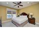 Comfortable bedroom featuring a ceiling fan, cozy window seat, and stylish bedside lamps at 4850 Cantor Ct. # 202, North Myrtle Beach, SC 29582