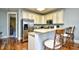 Well-equipped kitchen featuring stainless steel appliances, granite countertops, and breakfast bar seating at 4850 Cantor Ct. # 202, North Myrtle Beach, SC 29582