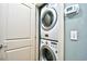 The laundry room features a stacked washer and dryer, and a digital thermostat at 4850 Cantor Ct. # 202, North Myrtle Beach, SC 29582