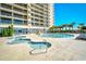Luxury resort pool with a separate kiddie pool, slide, and a building with balcony views in the background at 4850 Cantor Ct. # 202, North Myrtle Beach, SC 29582